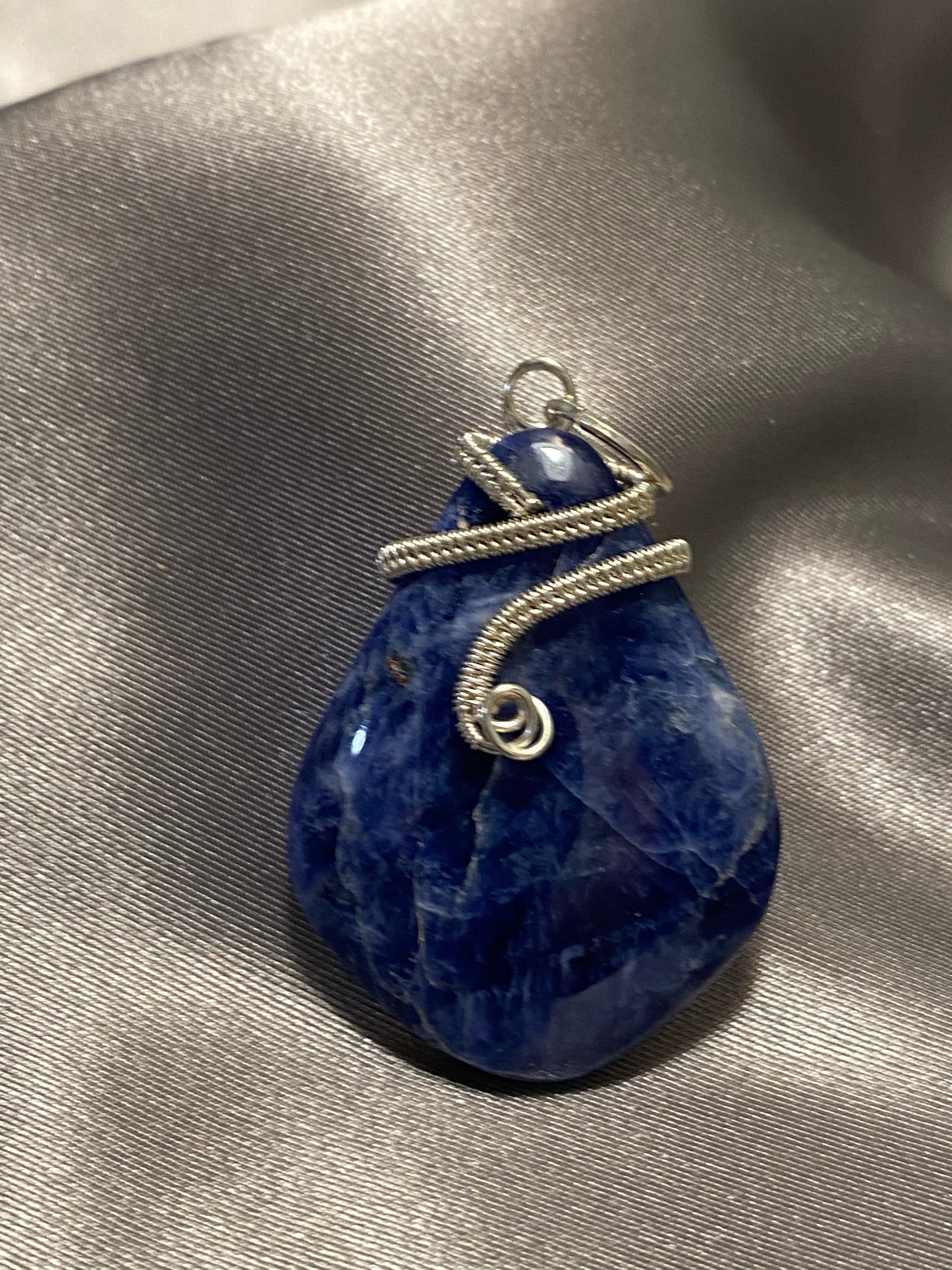 Sodalite pendant with wire weave nail