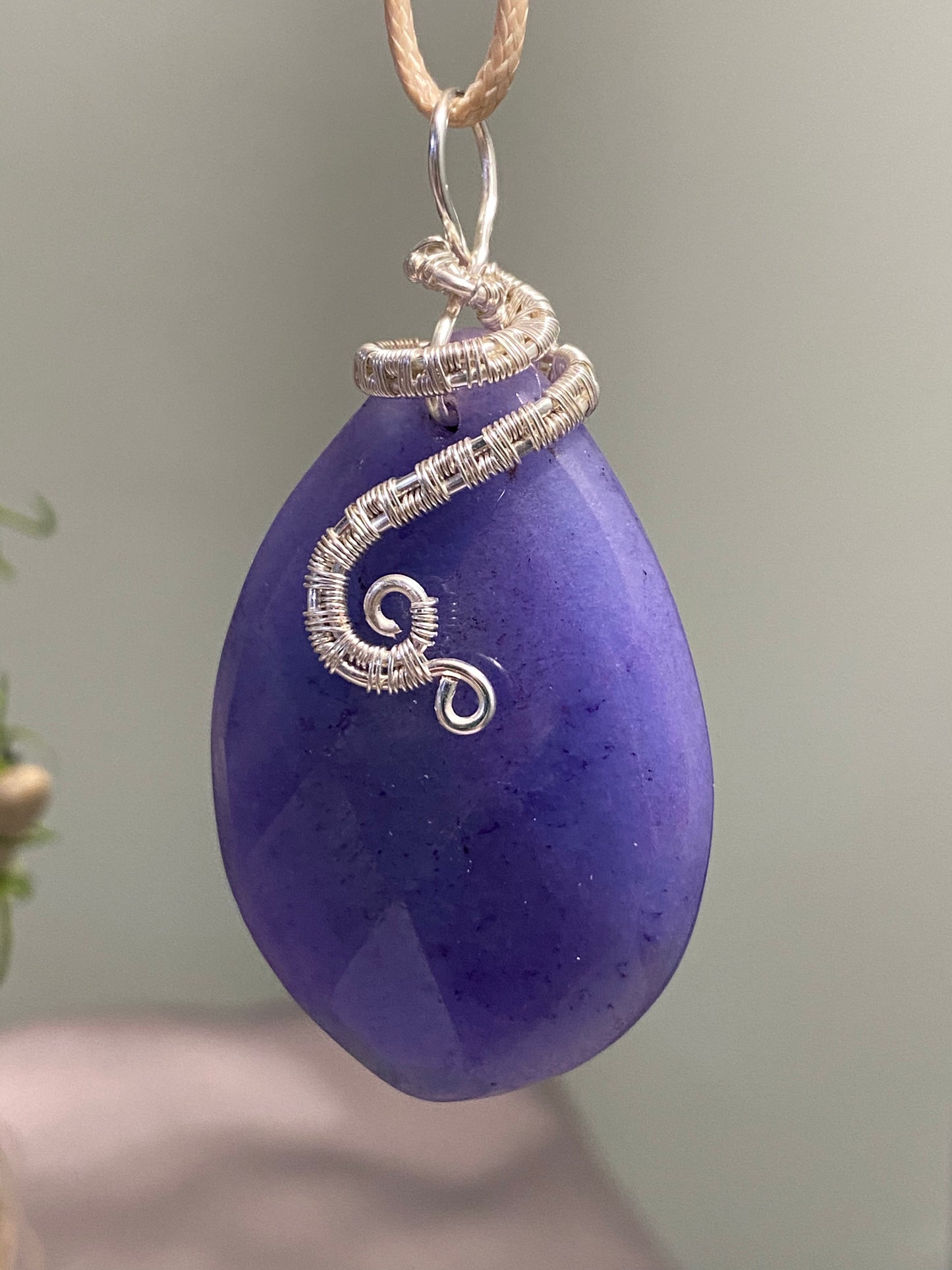 Blue calcite pendant with wire weave